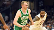 May 11, 2024; Cleveland, Ohio, USA: Boston Celtics forward Sam Hauser (30) dribbles the ball against Cleveland Cavaliers forward Marcus Morris Sr. (24) in the second quarter of game three of the second round of the 2024 NBA playoffs at Rocket Mortgage FieldHouse. Mandatory Credit: David Richard-Imagn Images