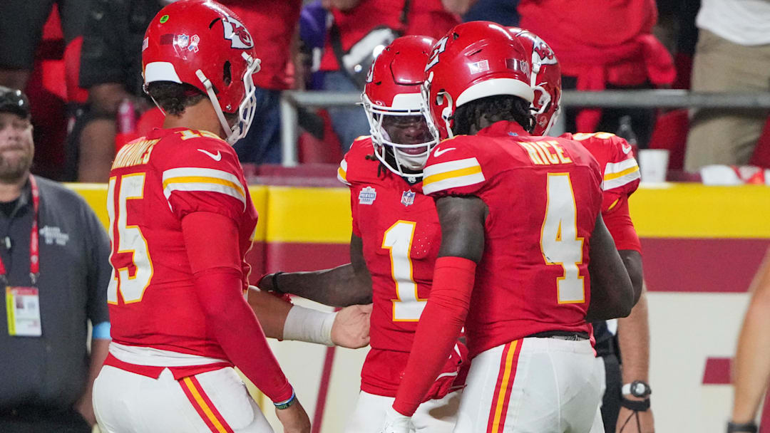 Sep 5, 2024; Kansas City, Missouri, USA; Kansas City Chiefs wide receiver Xavier Worthy (1) celebrates with quarterback Patrick Mahomes (15) and wide receiver Rashee Rice (4) after scoring a touchdown against the Baltimore Ravens during the game at GEHA Field at Arrowhead Stadium. Mandatory Credit: Denny Medley-Imagn Images
