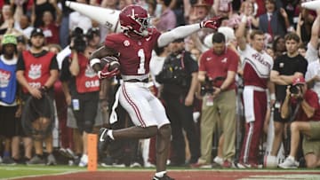 Aug 31, 2024; Tuscaloosa, Alabama, USA;  Alabama Crimson Tide wide receiver Kendrick Law (1) celebrates after scoring a touchdown against the Western Kentucky Hilltoppers during the first half at Bryant-Denny Stadium.  Mandatory Credit: Gary Cosby Jr.-Imagn Images