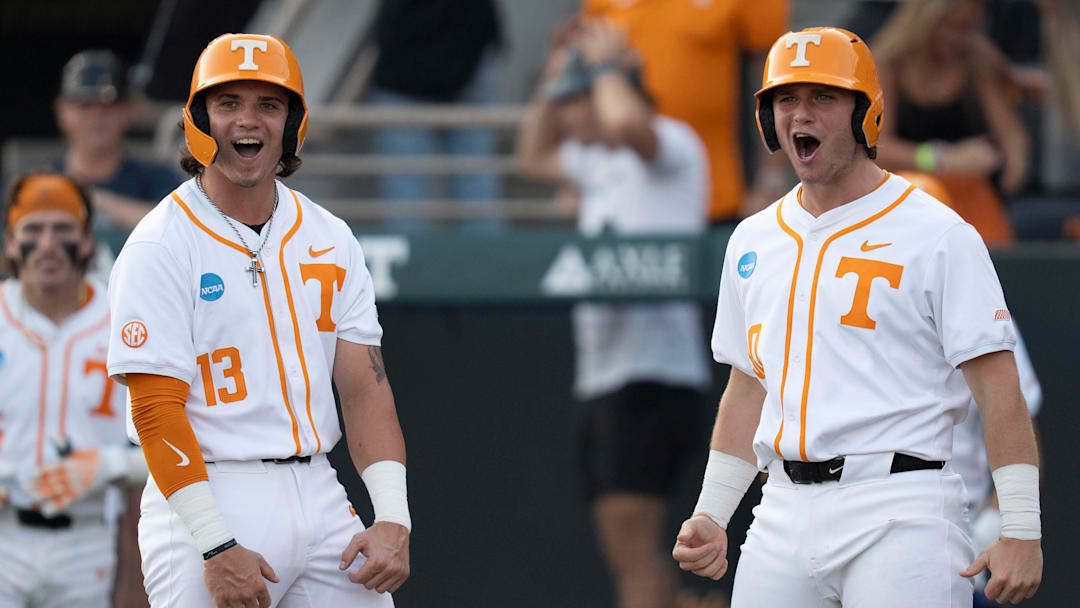 Tennessee's Reese Chapman (13) and Levi Clark (30) cheer for teammates Manny Marin (4) as he rounds the bases after hitting a home run at the NCAA college baseball Knoxville Regional final against Wake Forest on June 2, 2025, in Knoxville, Tenn. Tennessee's Reese Chapman (13) and Levi Clark (30) cheer for teammates Manny Marin (4) as he rounds the bases after hitting a home run at the NCAA college baseball Knoxville Regional final against Wake Forest on June 2, 2025, in Knoxville, Tenn.