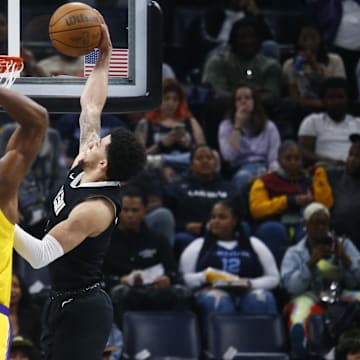 Memphis Grizzlies guard Scotty Pippen Jr. (1) dunks over Los Angeles Lakers forward Rui Hachimura (28) during the first half at FedExForum. Mandatory Credit: Petre Thomas-Imagn Images