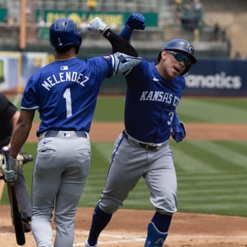 Jun 20, 2024; Oakland, California, USA; Kansas City Royals designated hitter Freddy Fermin (34) with teammate MJ Melendez (1) celebrates his solo home run against the Oakland Athletics during the second inning at Oakland-Alameda County Coliseum. 