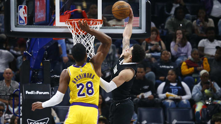 Memphis Grizzlies guard Scotty Pippen Jr. (1) dunks over Los Angeles Lakers forward Rui Hachimura (28) during the first half at FedExForum. Mandatory Credit: Petre Thomas-Imagn Images