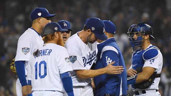 Oct 27, 2018; Los Angeles, CA, USA; Los Angeles Dodgers pitcher Rich Hill (middle) is relieved by manager Dave Roberts (second from right) in the sixth inning against the Boston Red Sox in game four of the 2018 World Series at Dodger Stadium. Mandatory Credit: Jayne Kamin-Oncea-USA TODAY Sports