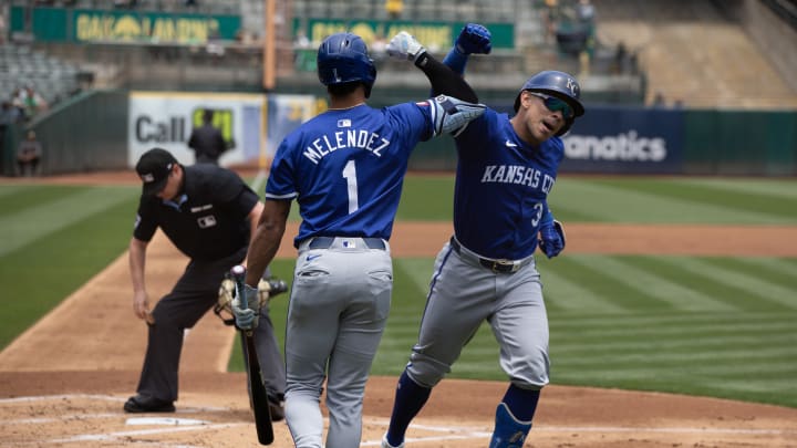 Jun 20, 2024; Oakland, California, USA; Kansas City Royals designated hitter Freddy Fermin (34) with teammate MJ Melendez (1) celebrates his solo home run against the Oakland Athletics during the second inning at Oakland-Alameda County Coliseum. 