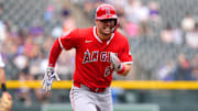 Sep 21, 2025; Denver, Colorado, USA; Los Angeles Angels designated hitter Mike Trout (27) scores a run in the first inning against the Colorado Rockies at Coors Field. Mandatory Credit: Ron Chenoy-Imagn Images