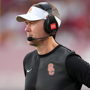 Aug 30, 2025; Los Angeles, California, USA; Southern California Trojans head coach Lincoln Riley watches from the sidelines against the Missouri State Bears in the first half at United Airlines Field at Los Angeles Memorial Coliseum. Mandatory Credit: Kirby Lee-Imagn Images