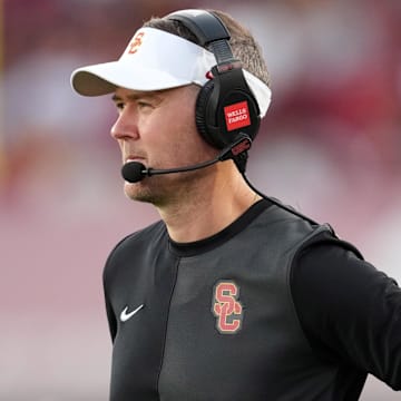 Aug 30, 2025; Los Angeles, California, USA; Southern California Trojans head coach Lincoln Riley watches from the sidelines against the Missouri State Bears in the first half at United Airlines Field at Los Angeles Memorial Coliseum. Mandatory Credit: Kirby Lee-Imagn Images