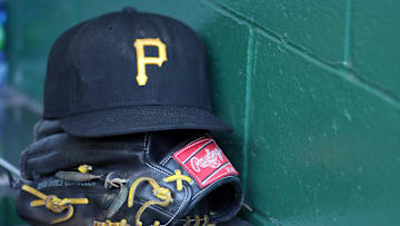 Sep 27, 2016; Pittsburgh, PA, USA;  A Pittsburgh Pirates hat and glove sit in the dugout prior to the game against the Chicago Cubs at PNC Park. Mandatory Credit: Charles LeClaire-Imagn Images