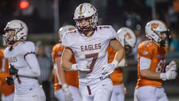 Dunlap's Mack Sutter comes off the field after an Eagles touchdown against Washington late in the second half of their Week 7 high school football game Friday, Oct. 11, 2024 at Babcook Field in Washington. The Panthers defeated the Eagles 31-10.