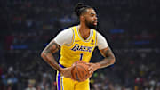 Feb 28, 2024; Los Angeles, California, USA; Los Angeles Lakers guard D'Angelo Russell (1) controls the ball against the Los Angeles Clippers during the first half at Crypto.com Arena. Mandatory Credit: Gary A. Vasquez-USA TODAY Sports
