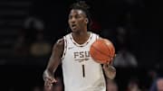 Mar 11, 2025; Charlotte, NC, USA;  Florida State Seminoles guard Jamir Watkins (1) brings the ball up court against the Syracuse Orange during the second half at Spectrum Center. Mandatory Credit: Jim Dedmon-Imagn Images
