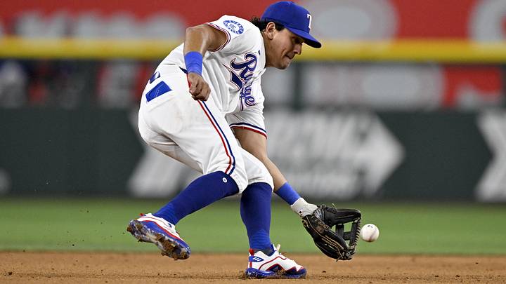 May 27, 2026; Arlington, Texas, USA; Texas Rangers shortstop Nicky Lopez (33) fields a ball hit by Houston Astros designated hitter Yordan Alvarez (44) during the sixth inning at Globe Life Field. Mandatory Credit: Jerome Miron-Imagn Images