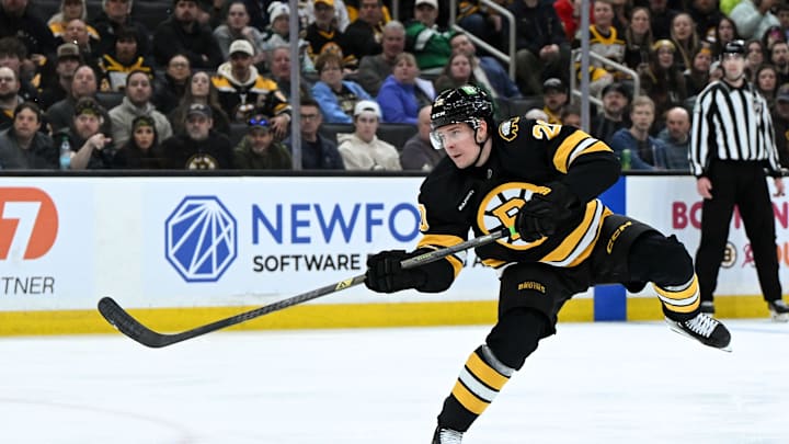 Mar 31, 2026; Boston, Massachusetts, USA; Boston Bruins defenseman Henri Jokiharju (20) shoots and scores against the Dallas Stars during the third period at the TD Garden. Mandatory Credit: Brian Fluharty-Imagn Images