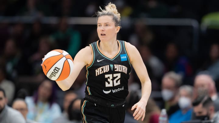 May 29, 2022; Seattle, Washington, USA; New York Liberty guard Sami Whitcomb (32) dribbles the ball against the Seattle Storm at Climate Pledge Arena. Mandatory Credit: Stephen Brashear-USA TODAY Sports