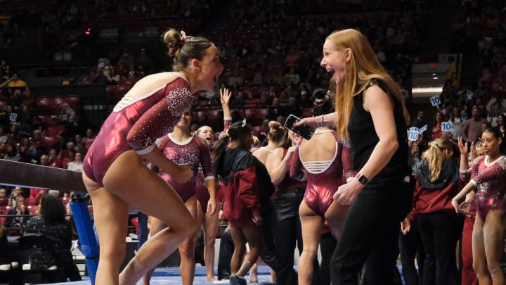 Mar 8, 2024; Tuscaloosa, Alabama, USA; Alabama gymnast Gabby Gladieux celebrates with Alabama head coach Ashley Johnston after her beam performance during a quad meet with Illinois, Minnesota, and Talladega at Coleman Coliseum.