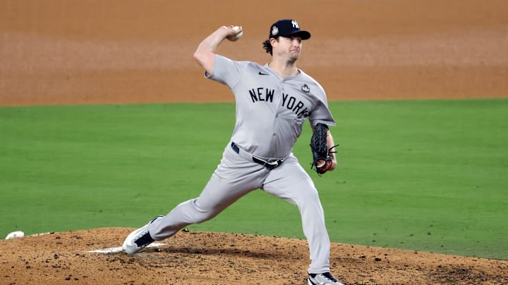 Oct 25, 2024; Los Angeles, California, USA; New York Yankees pitcher Gerrit Cole (45) pitches in the fifth inning against the Los Angeles Dodgers during game one of the 2024 MLB World Series at Dodger Stadium. Mandatory Credit: Kiyoshi Mio-Imagn Images