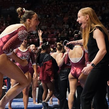 Mar 8, 2024; Tuscaloosa, Alabama, USA; Alabama gymnast Gabby Gladieux celebrates with Alabama head coach Ashley Johnston after her beam performance during a quad meet with Illinois, Minnesota, and Talladega at Coleman Coliseum.