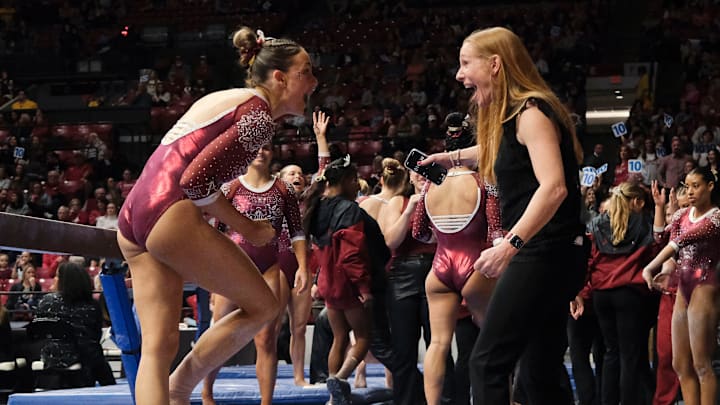 Mar 8, 2024; Tuscaloosa, Alabama, USA; Alabama gymnast Gabby Gladieux celebrates with Alabama head coach Ashley Johnston after her beam performance during a quad meet with Illinois, Minnesota, and Talladega at Coleman Coliseum.