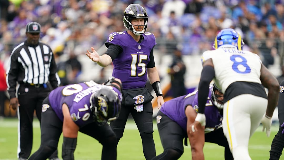 Oct 12, 2025; Baltimore, Maryland, USA; Baltimore Ravens quarterback Cooper Rush (15) calls a play at the line of scrimmage against the Los Angeles Rams during the first quarter of the game at M&T Bank Stadium. Mandatory Credit: Mitch Stringer-Imagn Images