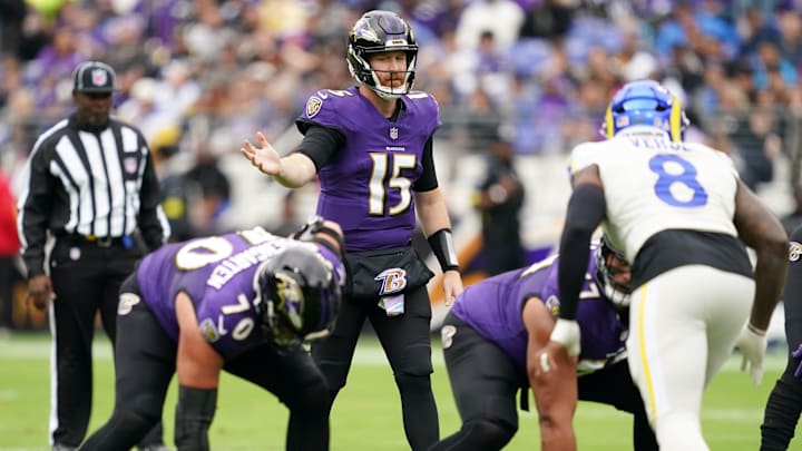 Oct 12, 2025; Baltimore, Maryland, USA; Baltimore Ravens quarterback Cooper Rush (15) calls a play at the line of scrimmage against the Los Angeles Rams during the first quarter of the game at M&T Bank Stadium. Mandatory Credit: Mitch Stringer-Imagn Images