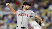 Aug 29, 2025; Los Angeles, California, USA; Arizona Diamondbacks starting pitcher Zac Gallen (23) pitches in the first inning against the Los Angeles Dodgers at Dodger Stadium. Mandatory Credit: Kirby Lee-Imagn Images