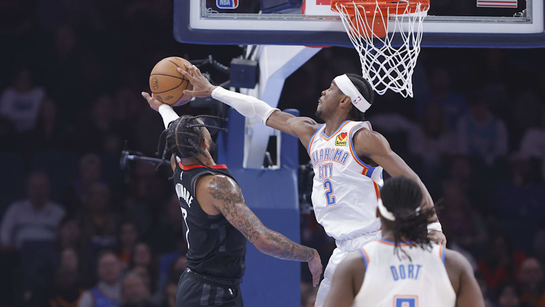 Mar 3, 2025; Oklahoma City, Oklahoma, USA; Oklahoma City Thunder guard Shai Gilgeous-Alexander (2) blocks a shot by Houston Rockets forward Cam Whitmore (7) during the first quarter at Paycom Center. Mandatory Credit: Alonzo Adams-Imagn Images