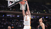 Dec 10, 2024; New York, New York, USA;  Tennessee Volunteers forward Igor Milicic Jr. (7) dunks in the first half against the Miami Hurricanes at Madison Square Garden. Mandatory Credit: Wendell Cruz-Imagn Images