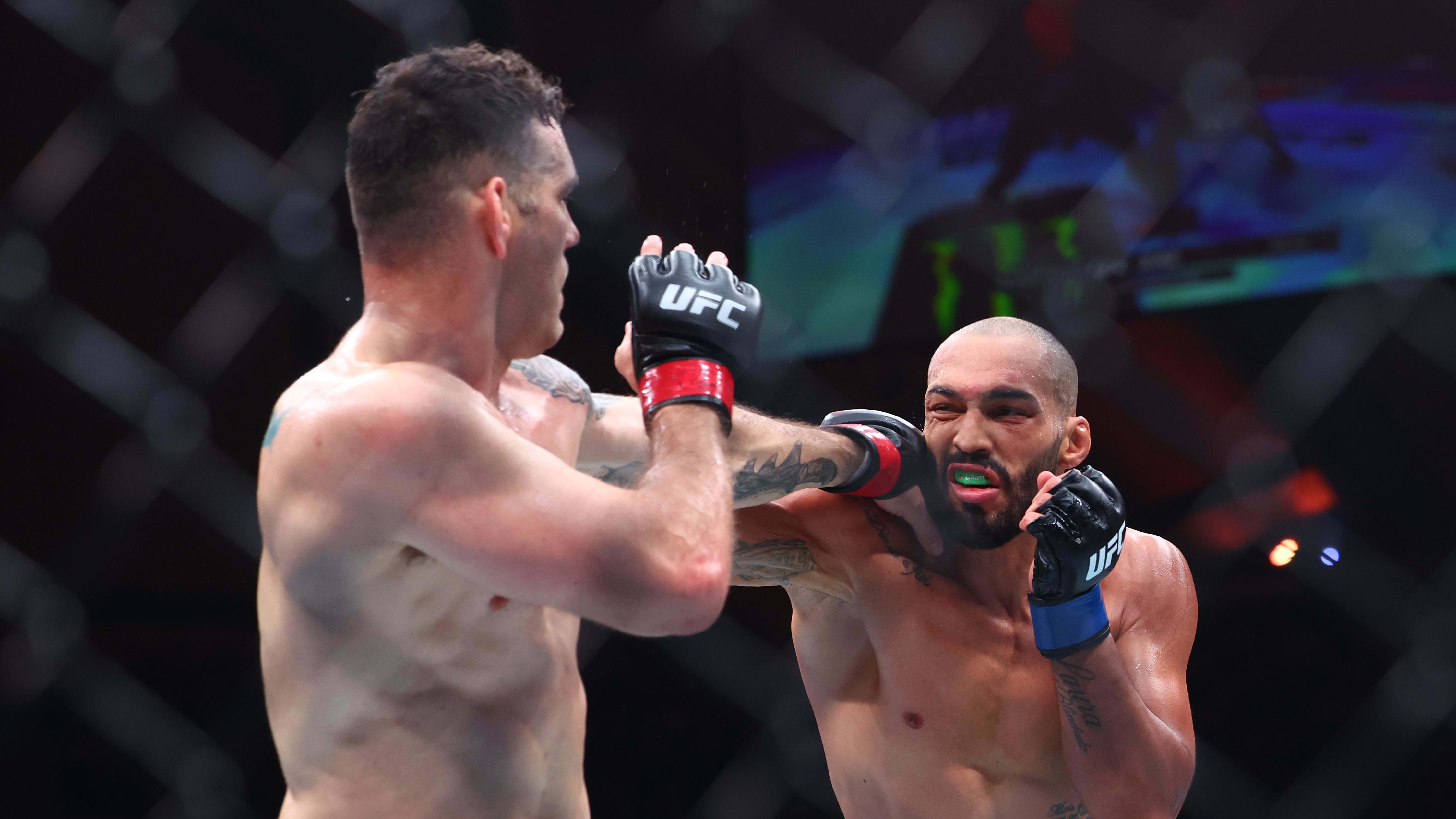 Mar 30, 2024; Atlantic City, New Jersey, USA; Chris Weidman (red gloves) fights Bruno Silva (blue