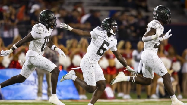 Oregon Ducks defensive back Jahlil Florence (6) celebrates an interception with Jamal Hill (19) and linebacker Jeffrey Bassa 