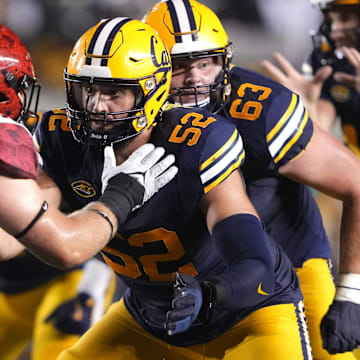 Nick Morrow (52) started 11 games last season as a redshirt freshman tackle