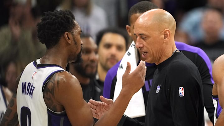 Dec 30, 2024; Sacramento, California, USA; Sacramento Kings interim head coach Doug Christie (right) is congratulated by guard Malik Monk (left) after defeating the Dallas Mavericks at Golden 1 Center. Mandatory Credit: Darren Yamashita-Imagn Images