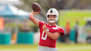 Jul 28, 2025; Miami Gardens, MI, USA; Miami Dolphins quarterback Zach Wilson (0) throws the football during training camp at Baptist Health Training Complex. Mandatory Credit: Sam Navarro-Imagn Images