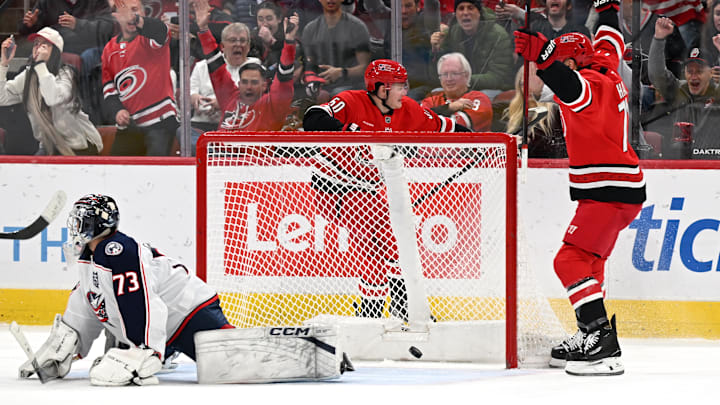 Blue Jackets goaltender Jet Greaves looks on as the Carolina Hurricanes celebrate the eventual game winning goal. 
