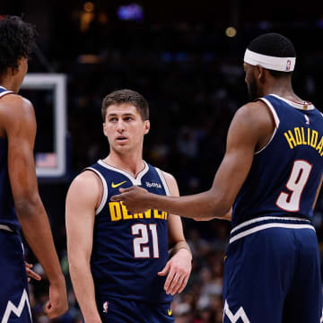 Mar 25, 2024; Denver, Colorado, USA; Denver Nuggets forward Peyton Watson (8) and guard Collin Gillespie (21) and forward Justin Holiday (9) in the third quarter against the Memphis Grizzlies at Ball Arena. Mandatory Credit: Isaiah J. Downing-USA TODAY Sports
