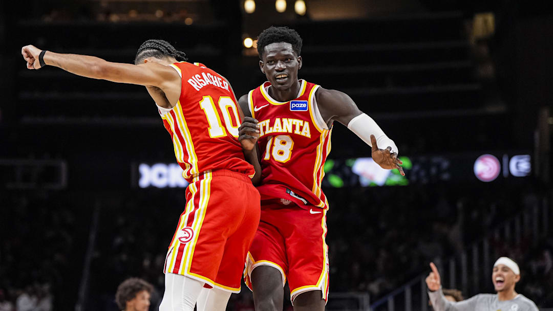 Nov 8, 2025; Atlanta, Georgia, USA; Atlanta Hawks forward Zaccharie Risacher (10) and forward Mouhamed Gueye (18) react after a play against the Los Angeles Lakers during the second half at State Farm Arena. Mandatory Credit: Dale Zanine-Imagn Images