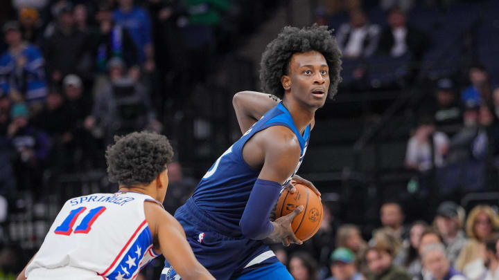 Nov 22, 2023; Minneapolis, Minnesota, USA; Minnesota Timberwolves forward Leonard Miller (33) looks to pass against the Philadelphia 76ers guard Jaden Springer (11) in the fourth quarter at Target Center. Mandatory Credit: Brad Rempel-USA TODAY Sports