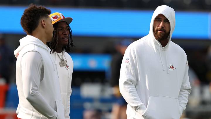 Jan 7, 2024; Inglewood, California, USA;  Kansas City Chiefs quarterback Patrick Mahomes (15) talks to wide receiver Rashee Rice (4) and tight end Travis Kelce (87) before the game against the Los Angeles Chargers at SoFi Stadium. Mandatory Credit: Kiyoshi Mio-Imagn Images