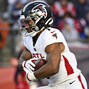Nov 2, 2025; Foxborough, Massachusetts, USA;  Atlanta Falcons running back Bijan Robinson (7) runs the ball against the New England Patriots during the third quarter at Gillette Stadium. Mandatory Credit: Eric Canha-Imagn Images