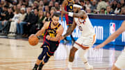 Jan 31, 2025; San Francisco, California, USA; Golden State Warriors guard Stephen Curry (30) dribbles past Phoenix Suns forward Royce O'Neale (00) in the second quarter at the Chase Center. Mandatory Credit: Cary Edmondson-Imagn Images