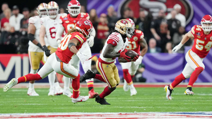 Feb 11, 2024; Paradise, Nevada, USA; San Francisco 49ers wide receiver Brandon Aiyuk (11) runs with the ball against Kansas City Chiefs safety Justin Reid (20) during the first quarter of Super Bowl LVIII at Allegiant Stadium. Mandatory Credit: Kirby Lee-USA TODAY Sports