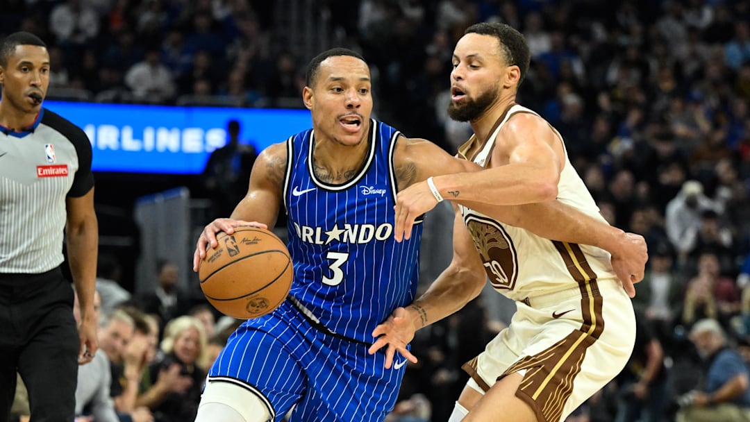 Dec 22, 2025; San Francisco, California, USA; Orlando Magic guard Desmond Bane (3) dribbles against Golden State Warriors guard Stephen Curry (30) in the second quarter at Chase Center. Mandatory Credit: Eakin Howard-Imagn Images