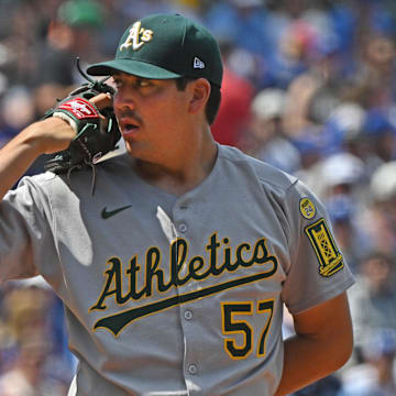 Jun 14, 2025; Kansas City, Missouri, USA;  Athletics starting pitcher Jacob Lopez (57) looks into home plate before throwing a pitch in the first inning against the Kansas City Royals at Kauffman Stadium. Mandatory Credit: Peter Aiken-Imagn Images