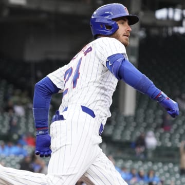 Apr 7, 2024; Chicago, Illinois, USA; Chicago Cubs outfielder Cody Bellinger (24) hits a home run against the Los Angeles Dodgers during the sixth inning at Wrigley Field.