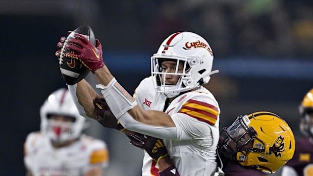 Iowa State Cyclones wide receiver Jayden Higgins catches a pass in front of Arizona State Sun Devils defensive back