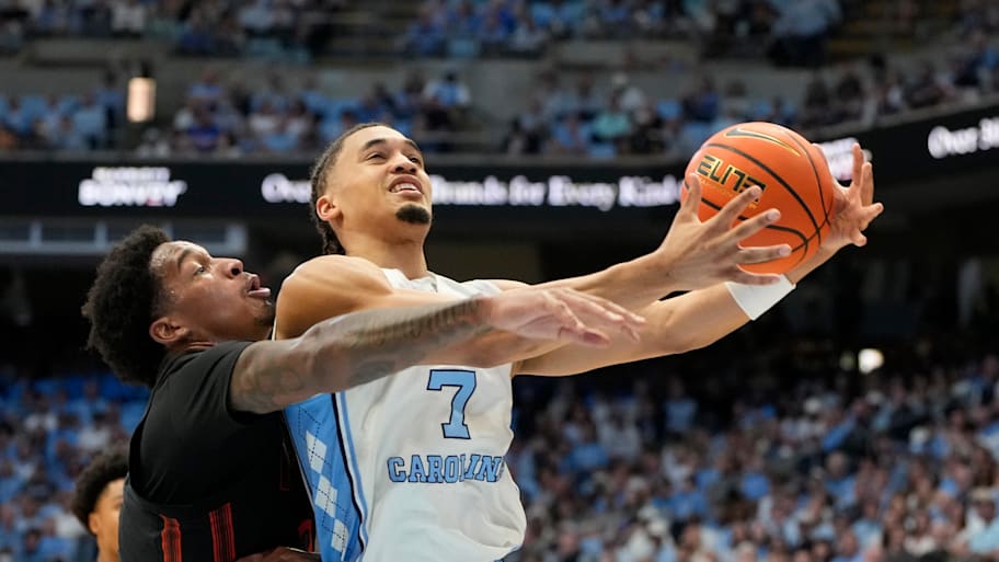 North Carolina guard Seth Trimble shoots as Miami forward Brandon Johnson.