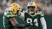 Green Bay Packers' Karl Brooks with Micah Parsons on the field in their win over the Detroit Lions at Lambeau Field.