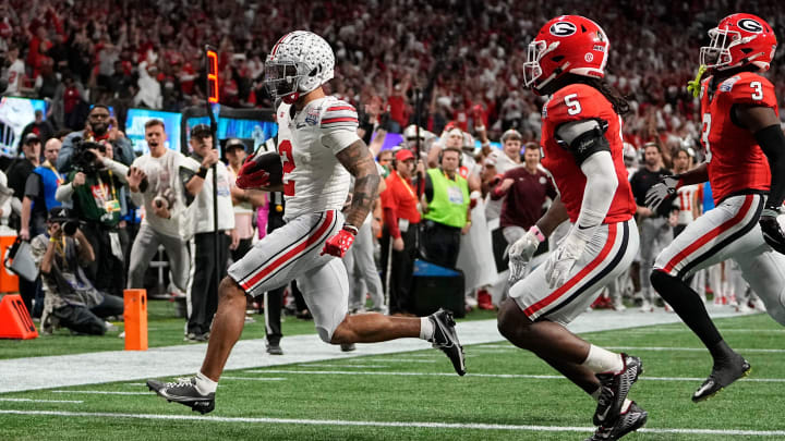 Dec 31, 2022; Atlanta, Georgia, USA;  Ohio State Buckeyes wide receiver Emeka Egbuka (2) runs past Georgia Bulldogs defensive back Kelee Ringo (5) for a touchdown during the second half of the Peach Bowl in the College Football Playoff semifinal at Mercedes-Benz Stadium. Ohio State lost 42-41. Mandatory Credit: Adam Cairns-The Columbus Dispatch

Ncaa Football Peach Bowl Ohio State At Georgia