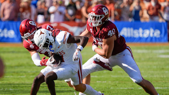 Oklahoma Sooners linebacker Jaren Kanak (7) brings down Texas Longhorns wide receiver Silas Bolden (11) beside Oklahoma Sooners defensive lineman Ethan Downs (40) during the Red River Rivalry college football game between the University of Oklahoma Sooners (OU) and the Texas Longhorns at the Cotton Bowl in Dallas, Saturday, Oct. 12, 2024. Texas one 34-3. Oklahoma Sooners linebacker Jaren Kanak (7) brings down Texas Longhorns wide receiver Silas Bolden (11) beside Oklahoma Sooners defensive lineman Ethan Downs (40) during the Red River Rivalry college football game between the University of Oklahoma Sooners (OU) and the Texas Longhorns at the Cotton Bowl in Dallas, Saturday, Oct. 12, 2024. Texas one 34-3.