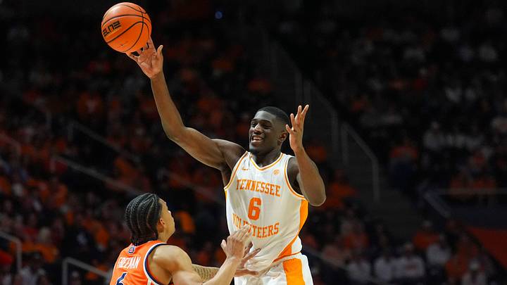 Tennessee forward DeWayne Brown II (6) passes the ball in front of Auburn's Elyjah Freeman (6) during a NCAA basketball game between the Tennessee Volunteers and Auburn Tigers at Thompson-Boling Arena at Food City Center in Knoxville, Tenn., on Jan. 31, 2026.
